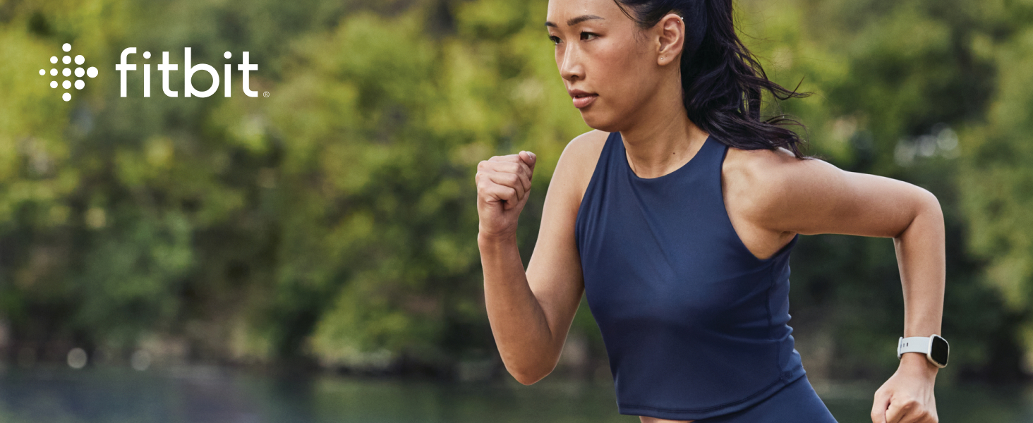 Fitbit logo over top an image of a woman running